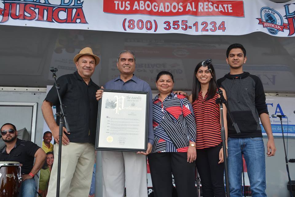 Assemblyman Ramos honors Bhadresh “Bob” Acharya, owner of Brentwood Pharmacy, at the 2015 Brentwood Arts & Salsa Festival.
