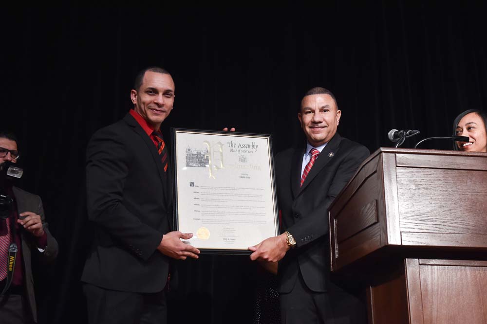 Ramos presents Edhuin Diaz a proclamation during the 4th Annual NYS Association of Black & Puerto Rican Legislators Legislative Conference for his work and contributions to the field of health care.