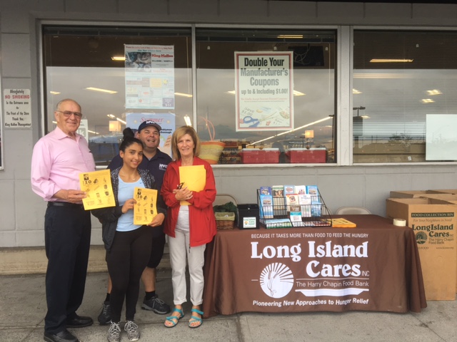 Assemblyman Dave McDonough (R,C,I-Merrick) pictured outside King Kullen grocery store Saturday where he and volunteers collected over 1,555 pounds of food for local families