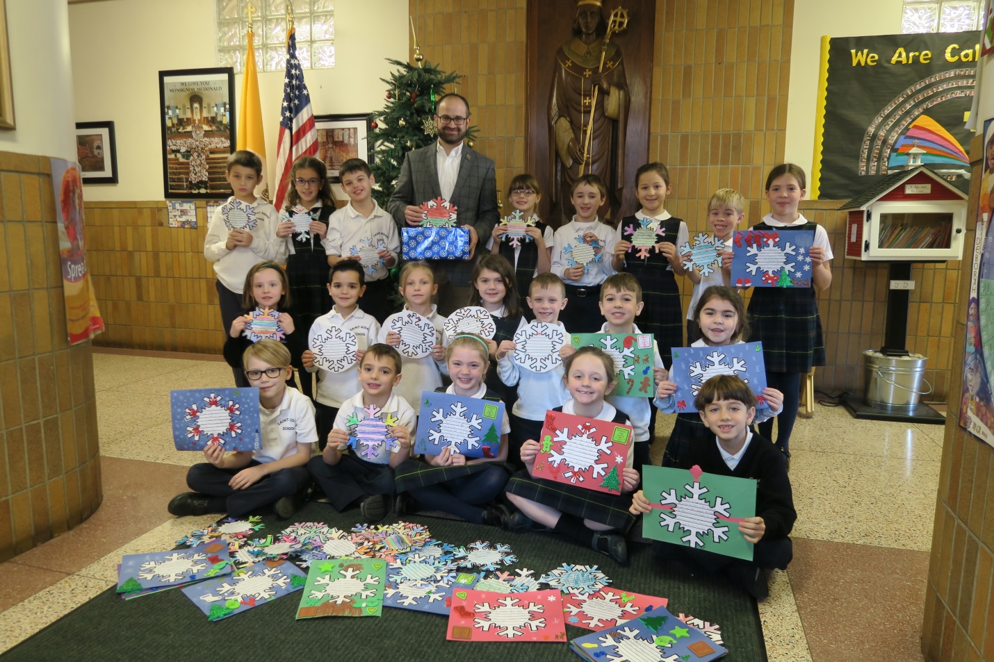 Assemblyman Ed Ra (R-Franklin Square) with students from St. Aidans lower school who participated in his annual Snowflakes for Seniors program to spread holiday cheer to local senior citizens.
