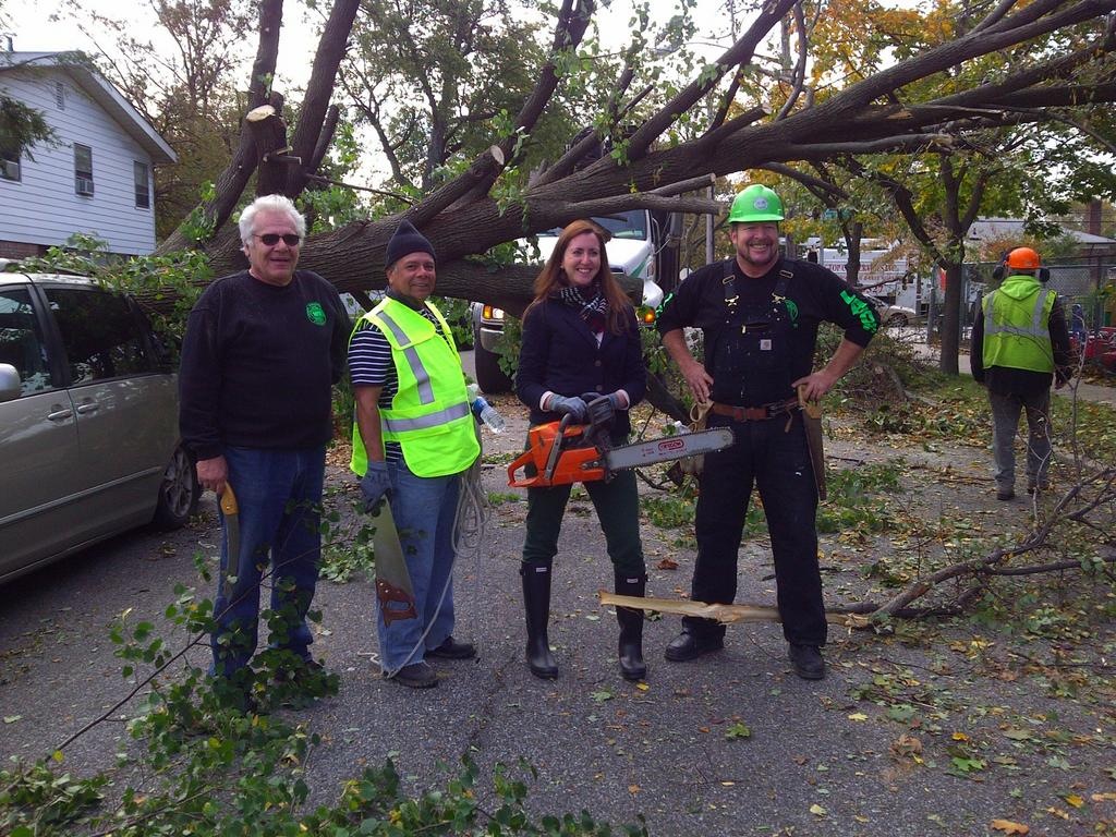 Assemblywoman Nily Rozic joined local volunteers to help cleanup efforts after Hurricane Sandy in Hillcrest.