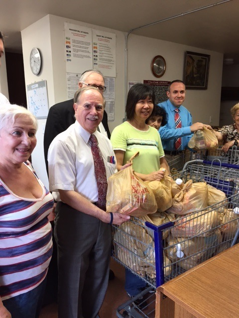 Assemblymember William Colton, Council Member Mark Treyger and Community Relations Director Nancy Tong helping with food giveaway at COJO of Bensonhurst.