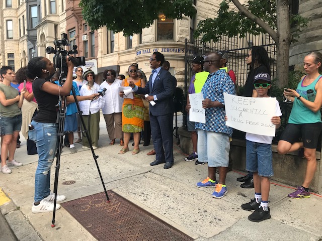 Assemblymember Al Taylor speaks in front of 30 St. Nicholas Avenue at a rally concerning Argus Community Inc.’s application to operate a methadone clinic at the location on July 11, 2018.