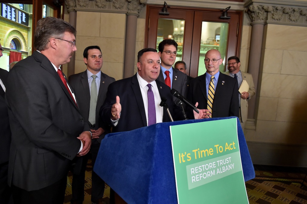 Assemblyman Karl Brabenec [at podium] joins colleagues in Albany to fight corruption in New York's economic development programs