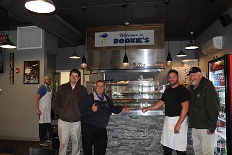 Brabenec [center left] poses with owners of Rookie’s on Main Street in Florida.