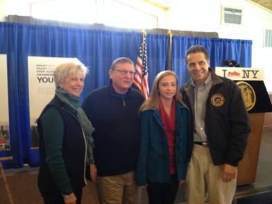 Assemblyman Ken Blankenbush (R,C,I-Black River), his wife, Sheila, and his granddaughter, Claire, join Gov. Cuomo at an event held at the Ridgeview Inn in Lowville where the assemblyman spoke about th