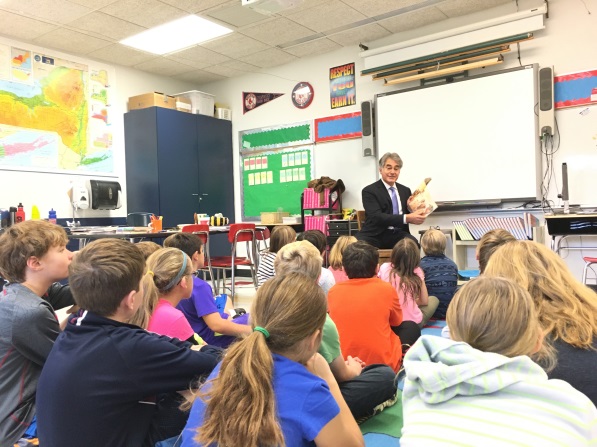 Assemblyman Al Stirpe visited all six schools in the Fayetteville-Manlius School District recently. Here he is reading to a class at Fayetteville Elementary.