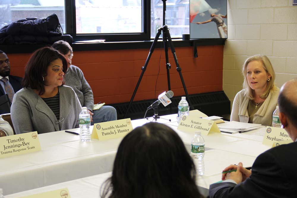 Assemblymember Pamela J. Hunter and Senator Kirsten Gillibrand discuss issues of gun trafficking at a roundtable at the Southwest Community Center in Syracuse on January 15, 2016