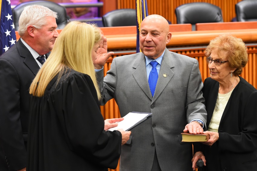 Assemblyman Angelo Morinello joined by his mother in taking his oath of office.