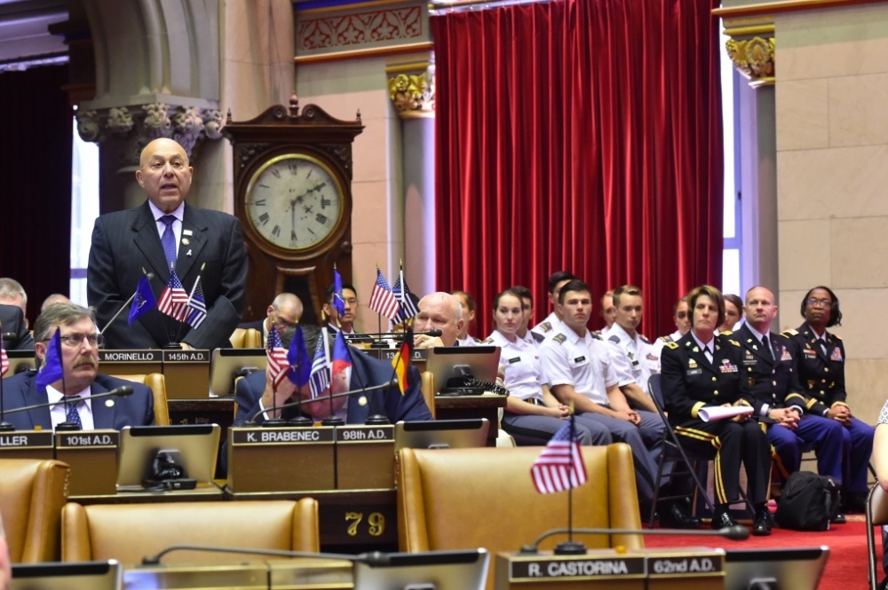 Assemblyman Angelo J. Morinello (R,C,I-Ref-Niagara Falls) speaking in the assembly chambers about 'West Point Day'.