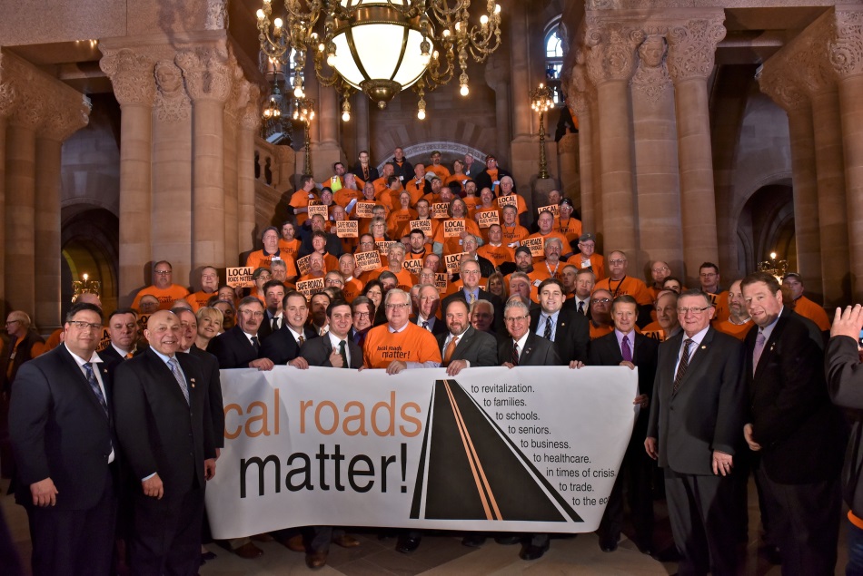 Assemblyman Angelo J. Morinello (R,C,I,Ref-Niagara Falls) stands alongside road workers at CHIPS rally in the State Capitol on Wednesday, March 6.