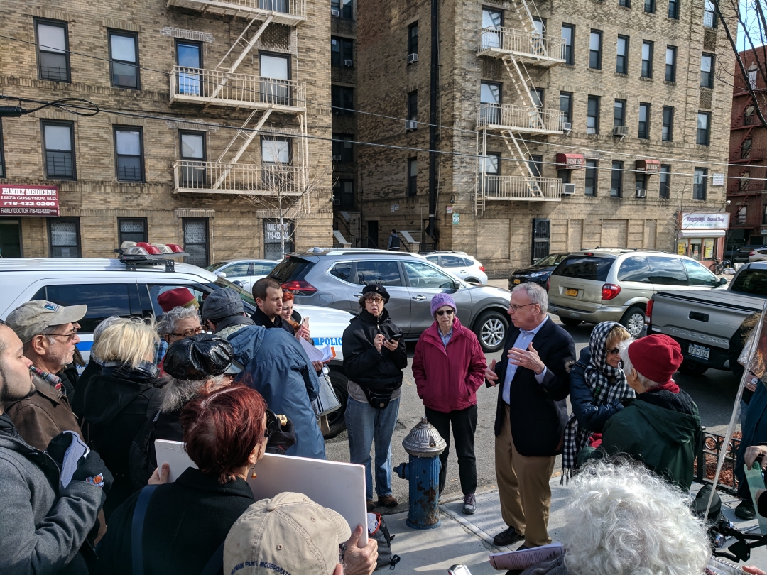 Assemblyman Dinowitz pictured with several dozen activists after the rally for public financing on Friday afternoon.