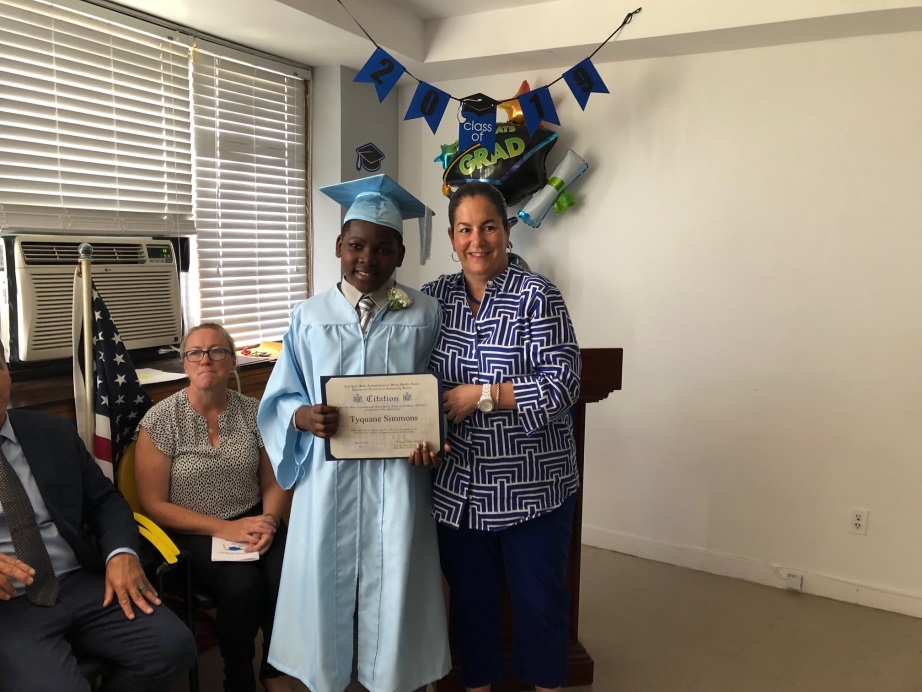 Assemblymember Stacey Pheffer Amato presenting an award at the St. Johns Home for Boys/ PS 256 Graduation