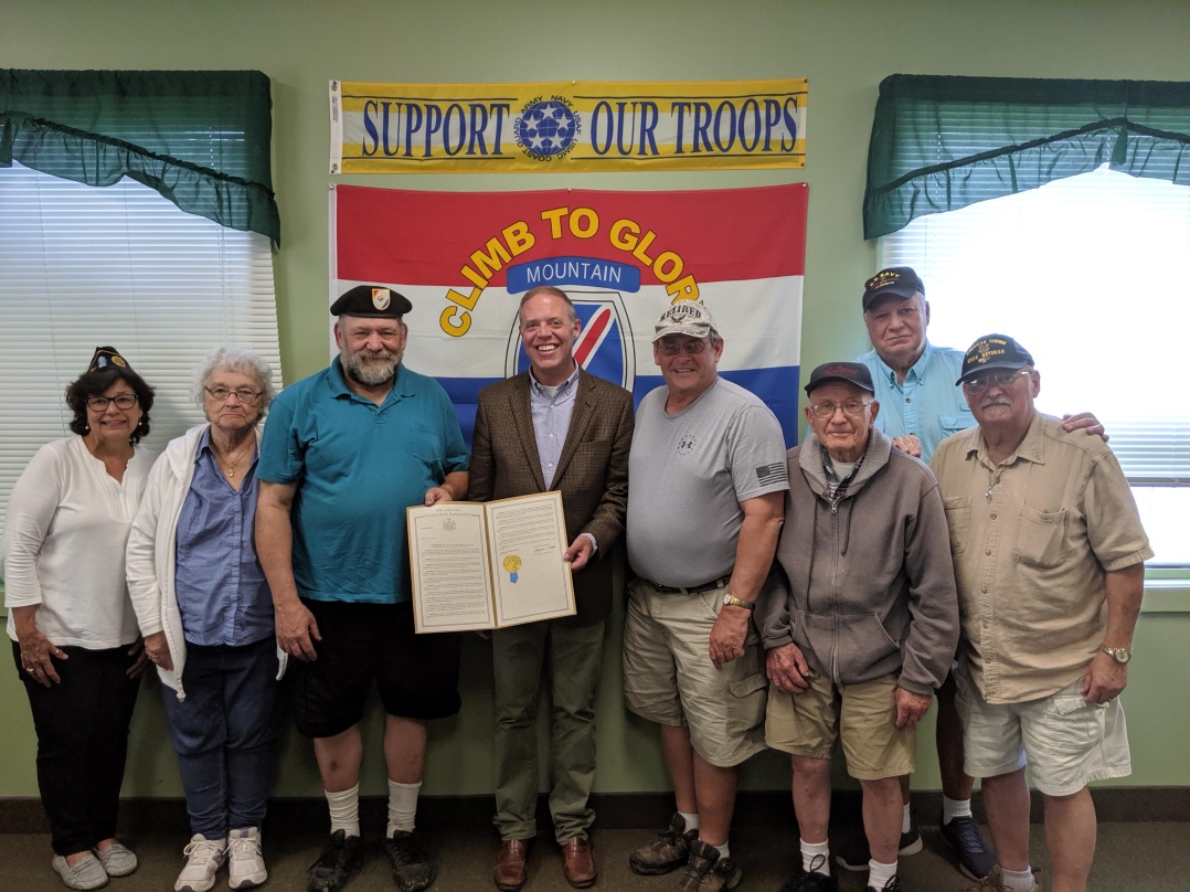 Assemblyman Will Barclay recently presented Garry Visconti with an Assembly Resolution honoring him for being named Fulton’s Veteran of the Year.  Pictured with Barclay and Visconti in center are members of the Fulton Veterans Council. From left are 