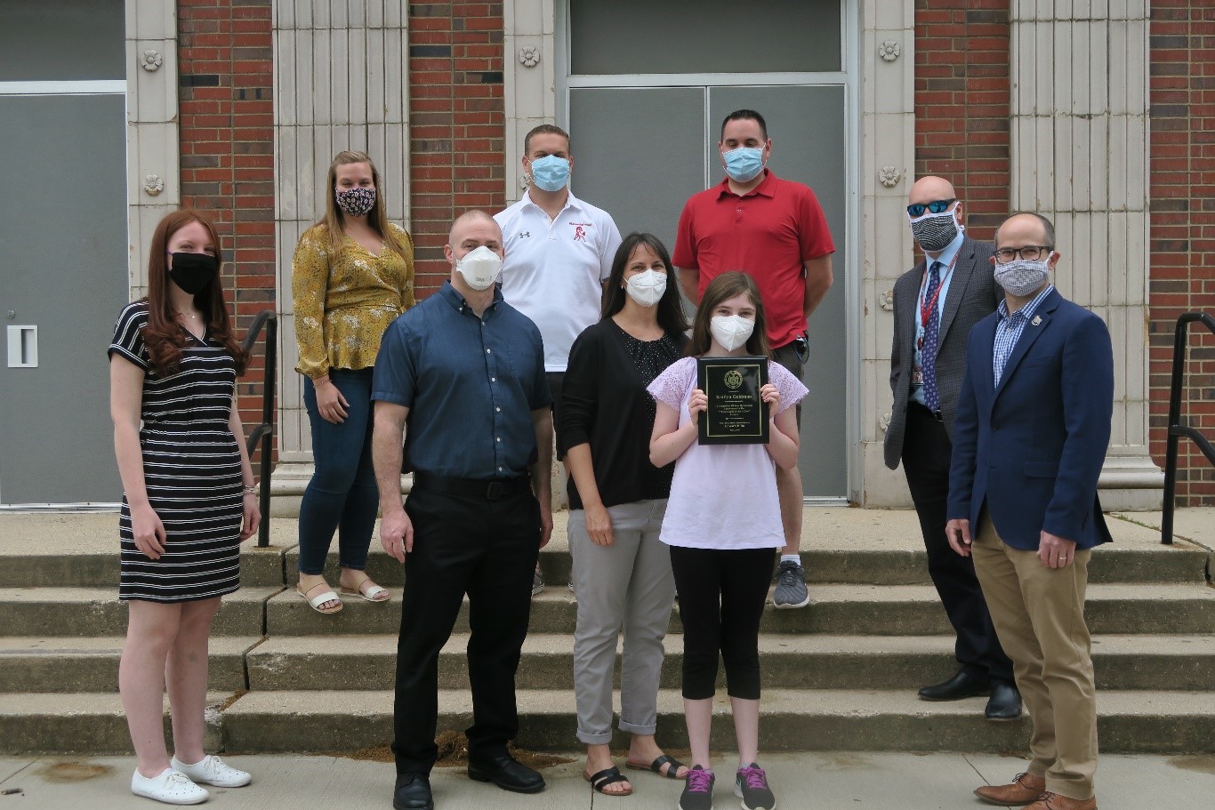 Center: Winner Kaitlyn Goldman is pictured with her parents. Back Row, from Left to Right: Her teacher, Ms. Jenna Cavuto, Assistant Principal Amy Trojanowski, Principal Andrew Casale, Dean of Students Mr. Steve Benner, District Superintendent Dr. Michael 